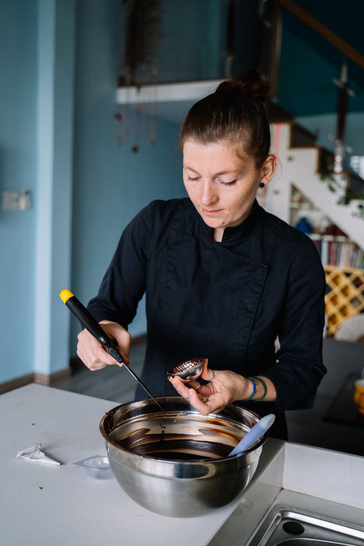 A Woman In Black Chef Jacket