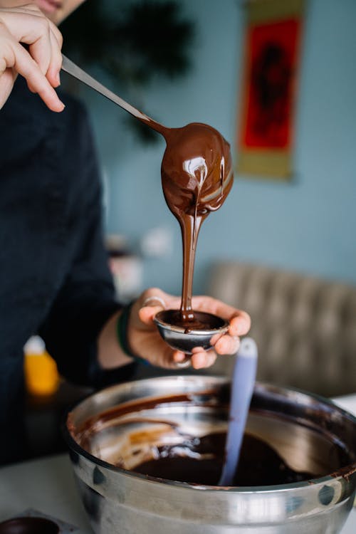 Free Photo Of Person Pouring Chocolate On A Silver Mini Bowl Stock Photo