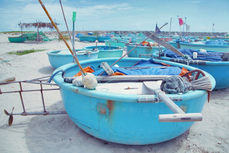 Many Round Fishing Boats Placed On Sandy Beach