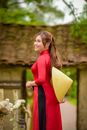Woman in Red Long Sleeve Dress Holding Yellow Umbrella
