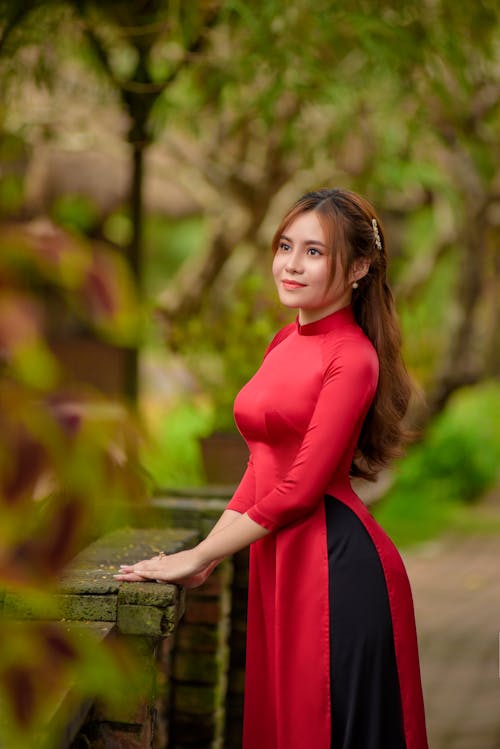 A Pretty Woman Wearing a Red Ao Dai