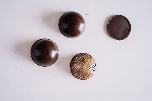 Free Delicate chocolate desserts with artistic patterns on a clean white surface, perfect for food photography. Stock Photo