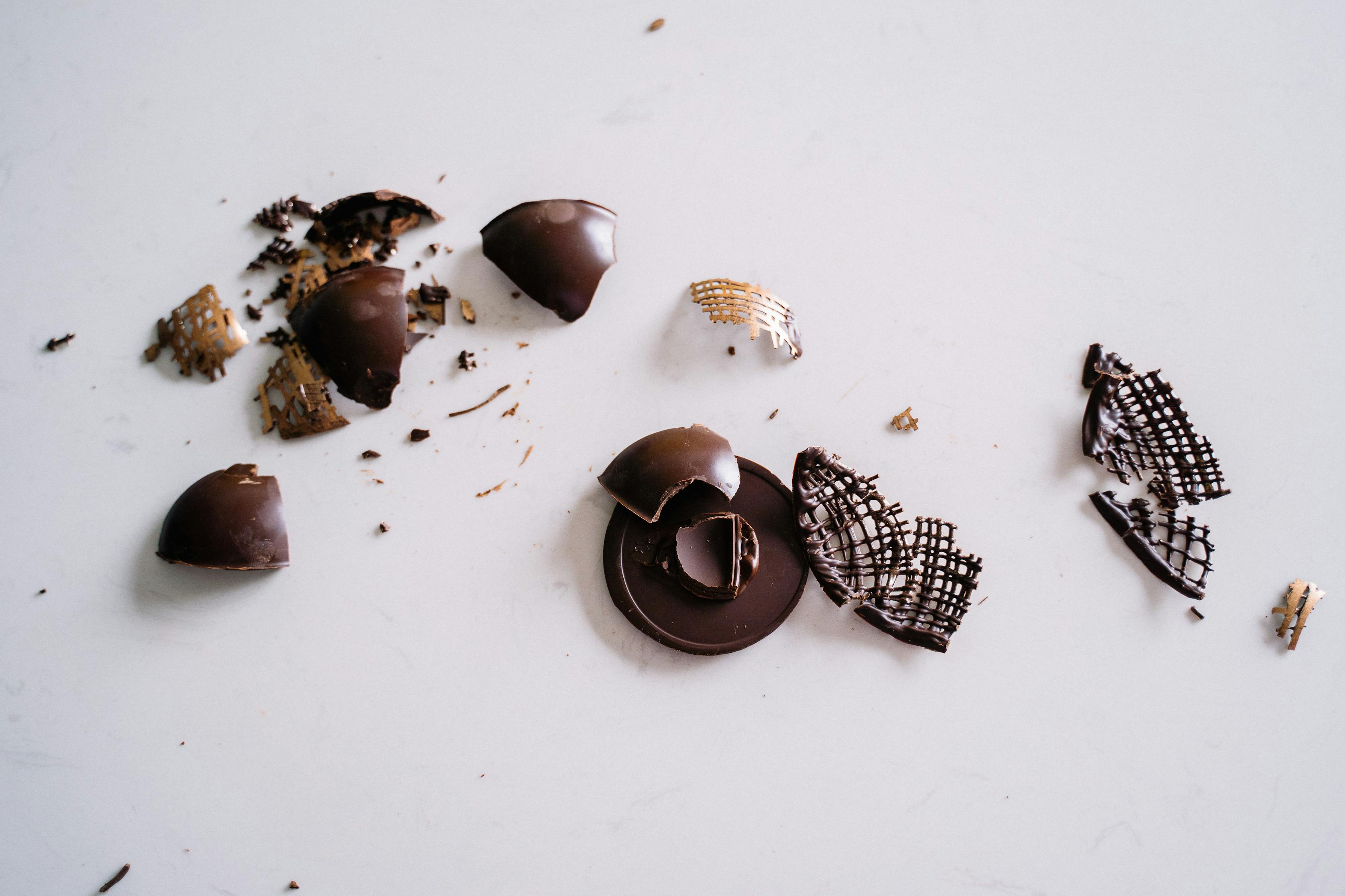 Photo Of Smashed Chocolate On A White Background · Free Stock Photo