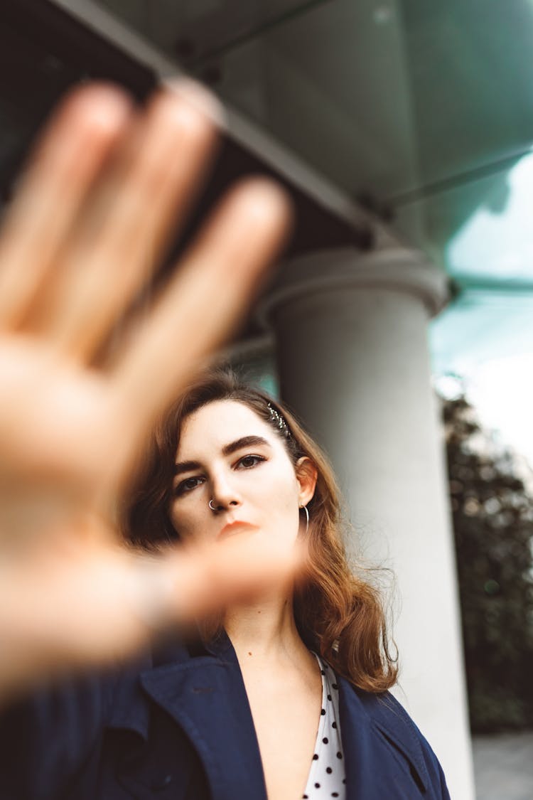 Woman Covering Face With Hand