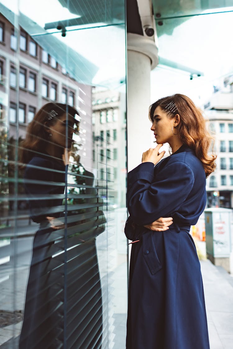 Elegant Woman Looking In Building Window From Street