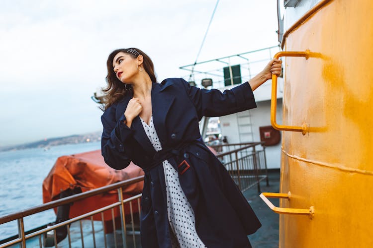 Woman In Coat On Ship