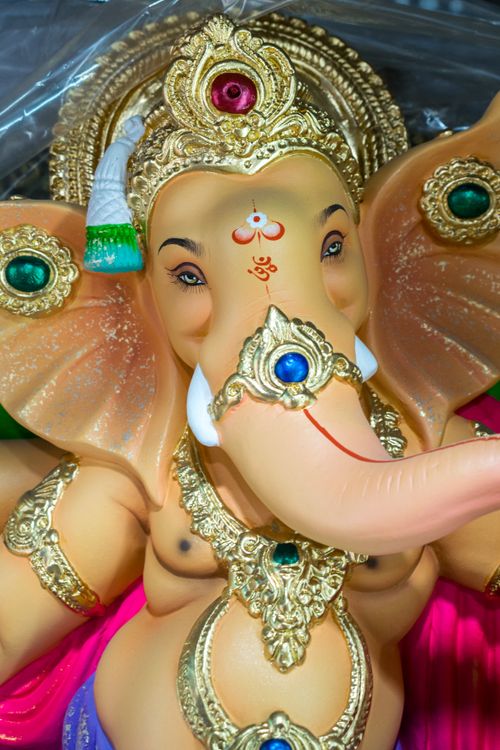 Free Intricate close-up photo of a Ganesha statue with rich embellishments, capturing divine elegance. Stock Photo