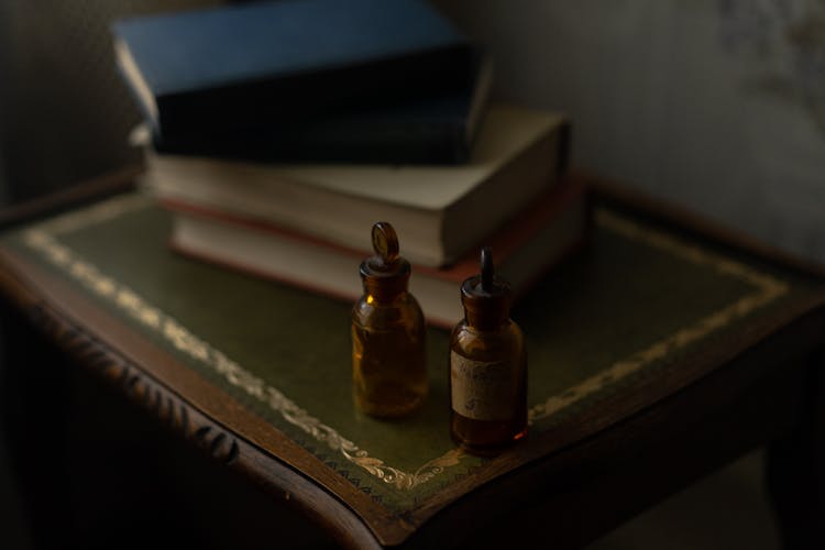 Essential Oil Bottle On The Table 