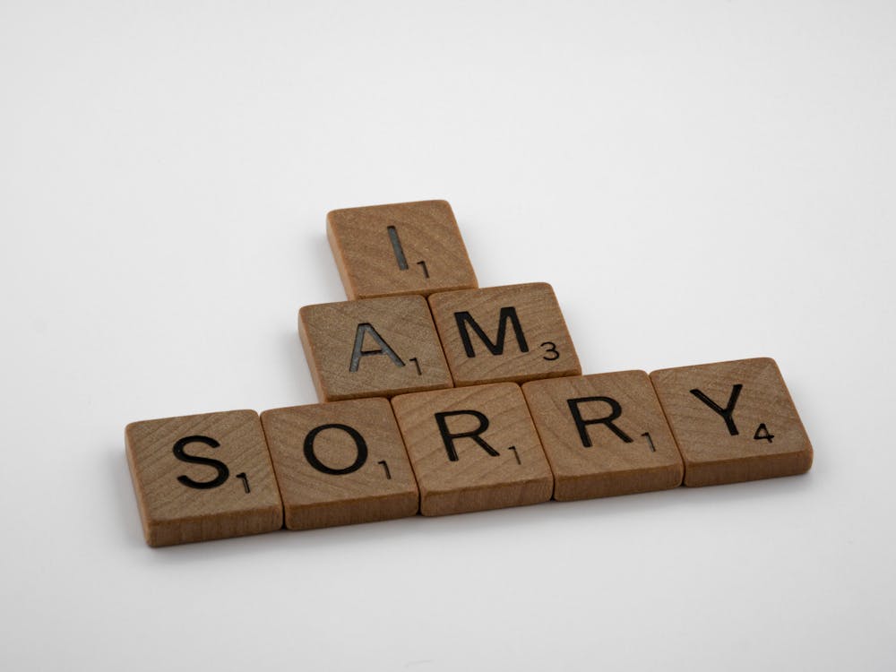 Free Brown Wooden Letter Blocks on White Surface Stock Photo