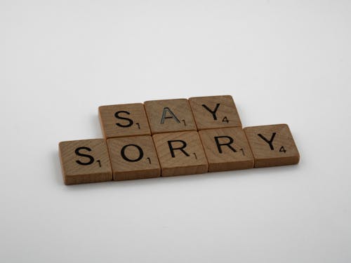  Wooden Scrabbles Pieces on White Table