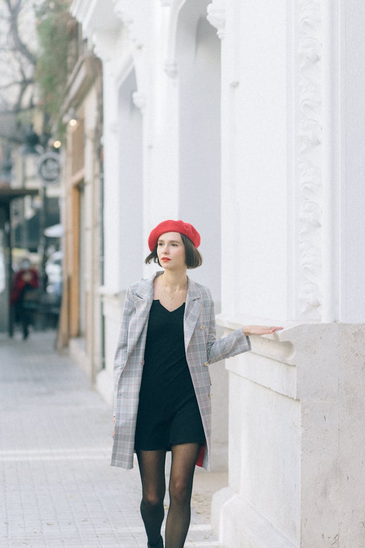 A Woman On A Sidewalk