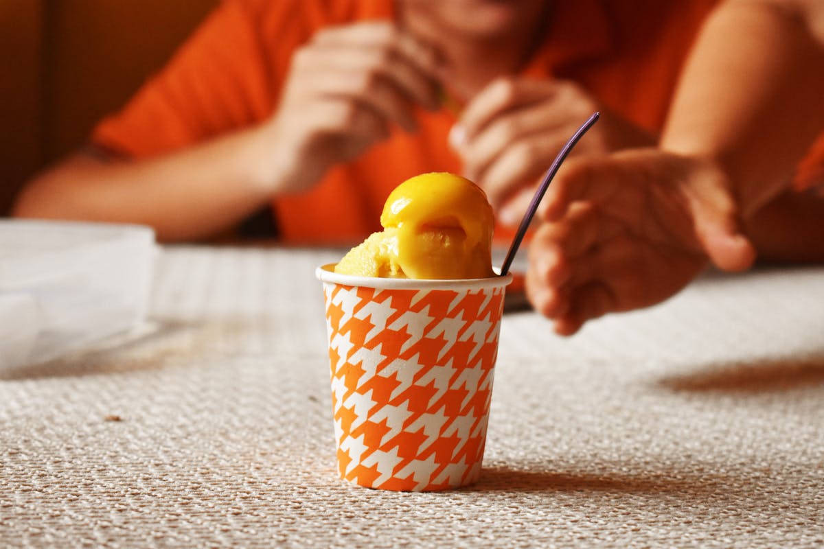 Colorful non-alcoholic mocktails with citrus and herbs on a table