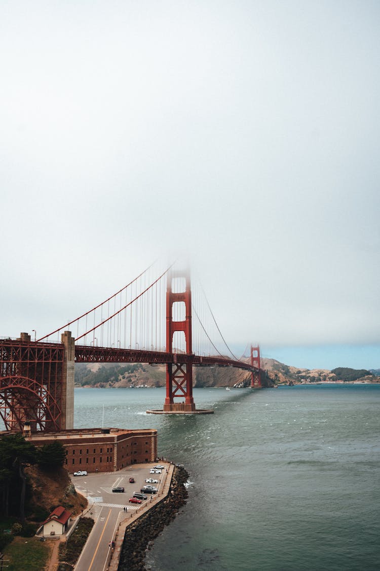 Historic Suspension Bridge Hidden Under Thick Fog In City