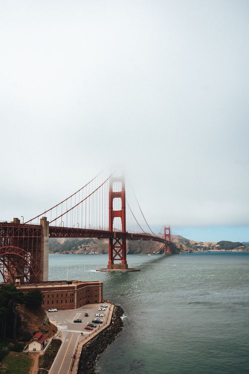 Free Spectacular scenery of foggy sky over famous Golden Gate Bridge over bay on cloudy day in San Francisco Stock Photo