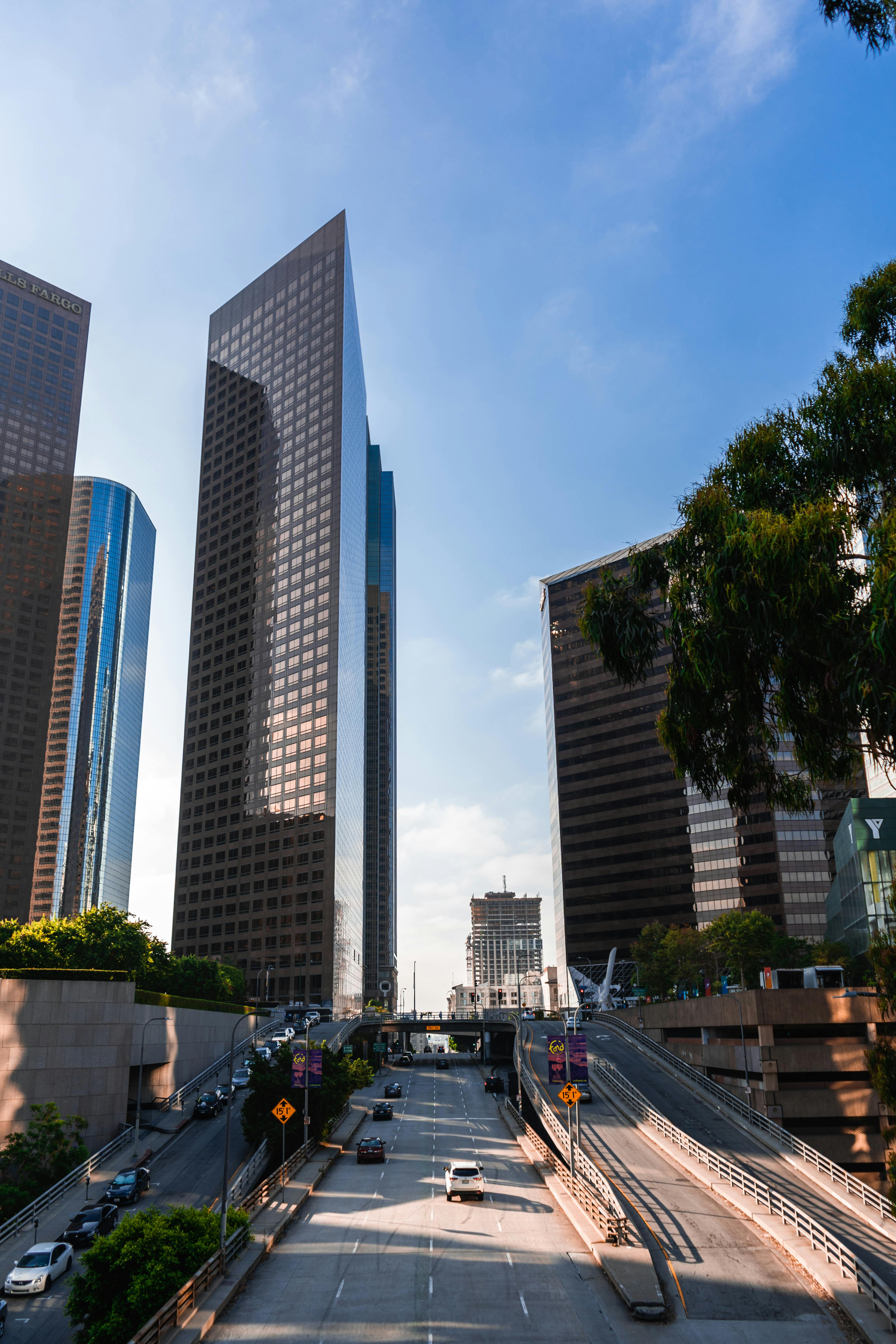 modern city with modern skyscrapers and roads in sunlight