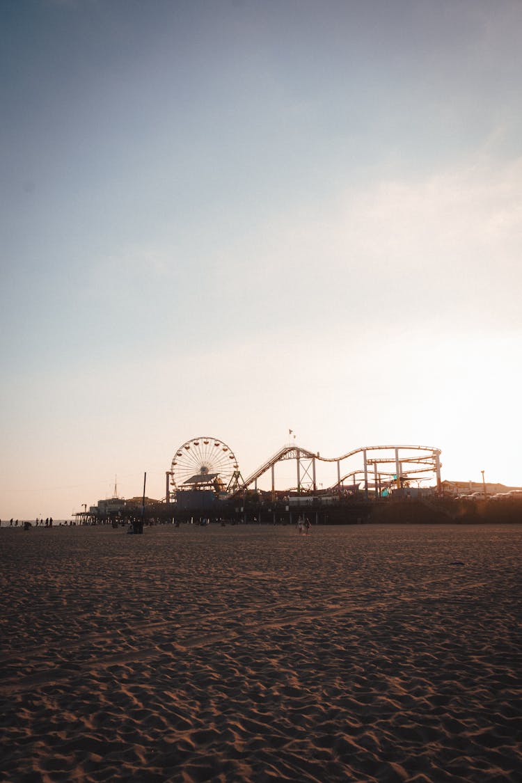 Amusement Park On Sandy Beach At Sundown