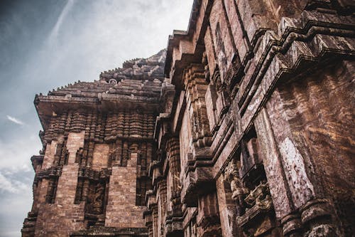 Exterior details of ancient Hindu temple decorated with carvings