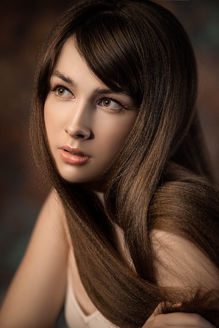 Crop Young Dreamy Woman With Silky Hair