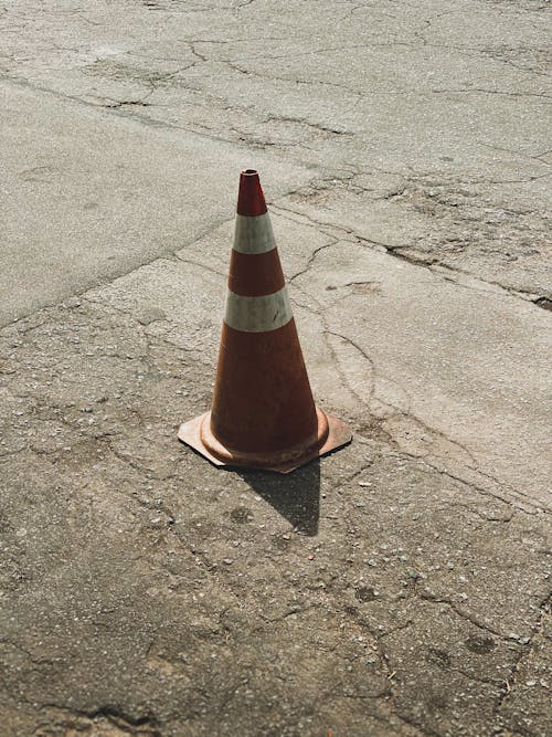 Traffic Cone on Cracked Pavement
