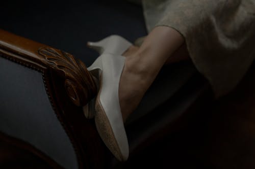 Free Close Up Photo of Person Wearing White Leather Heels Stock Photo