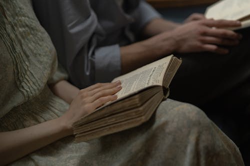 Selective Focus of People Reading Book 