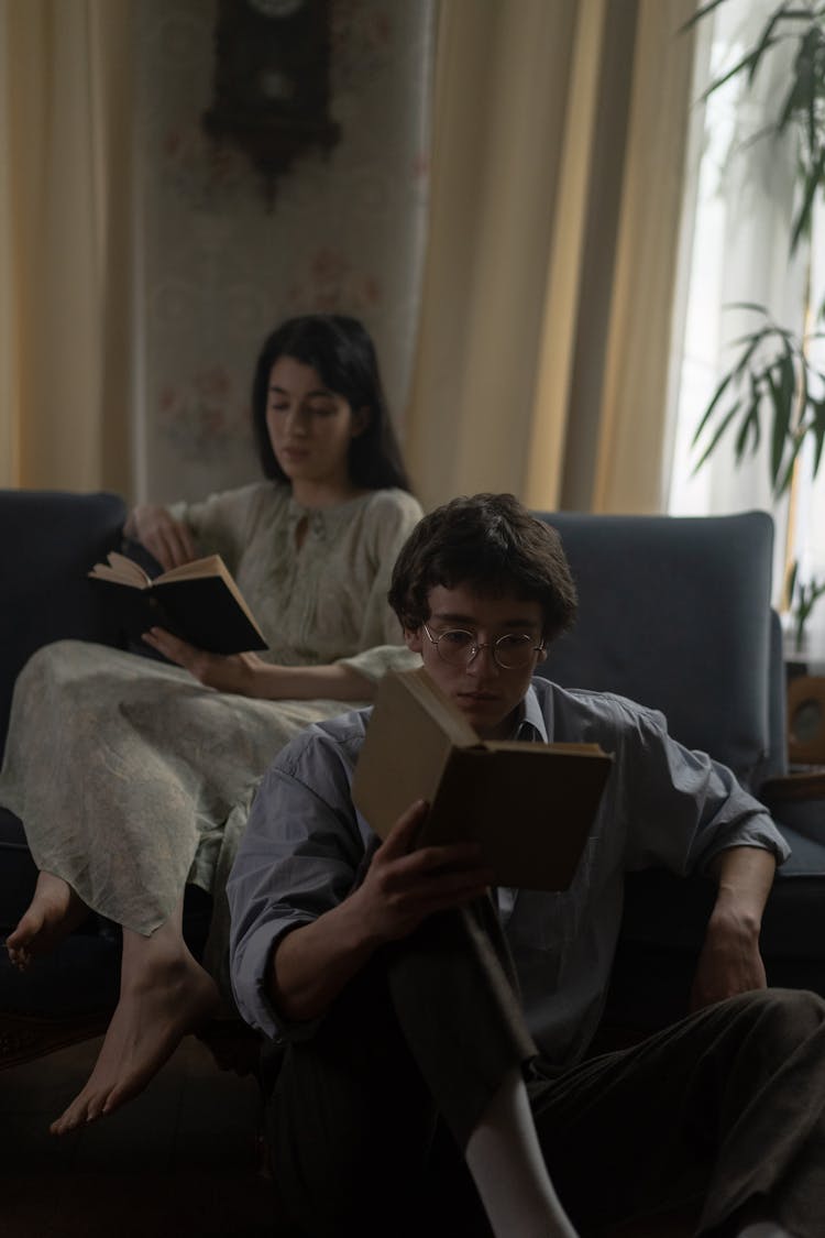 Man And Woman Reading Books Together 