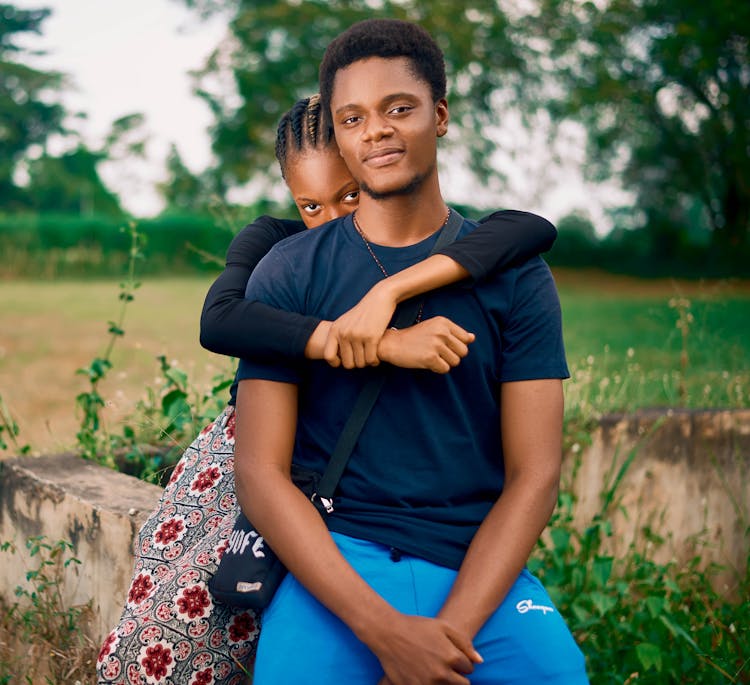 Black Couple Of Teenagers In Countryside