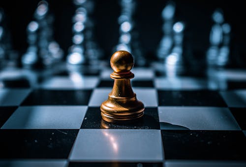 Free Gold Chess Piece on Chess Board Stock Photo