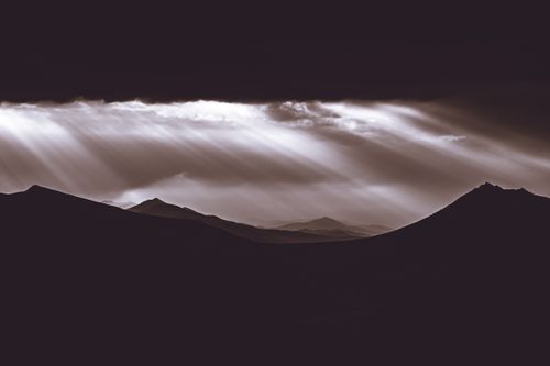 Free Gorgeous twilight beams over mountainous silhouettes in Podkarpackie, Poland. Stock Photo