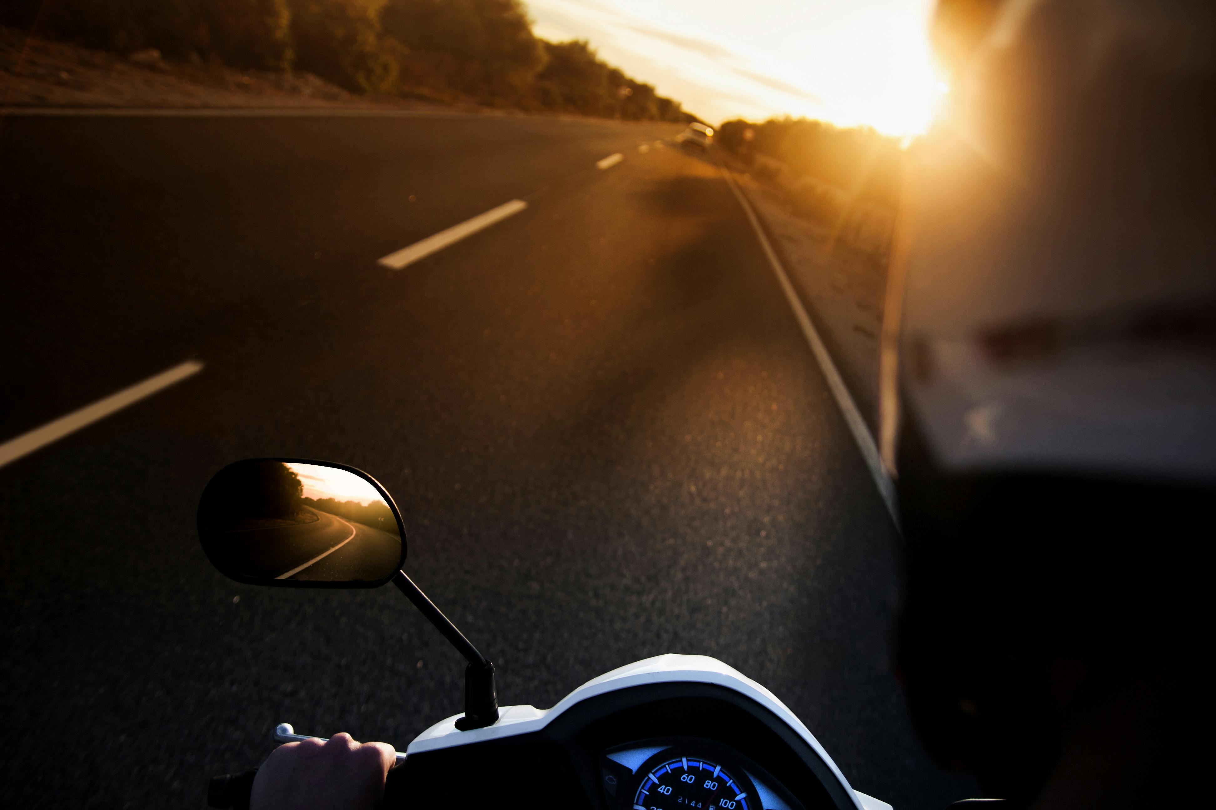 Person Riding on Motorcycle