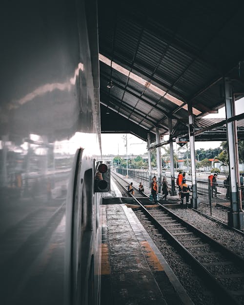 People Standing on Railroad Track