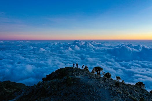 Breathtaking mountain view at sunset above the clouds in Guatemala, perfect for nature enthusiasts.
