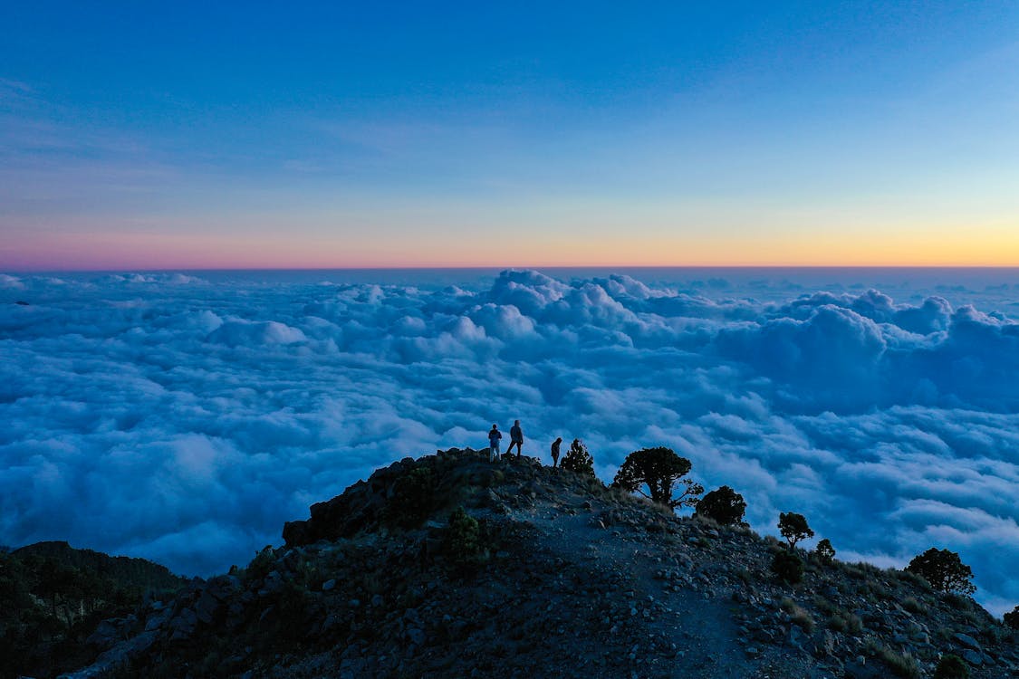 Free People Watching the Sea of Clouds Stock Photo