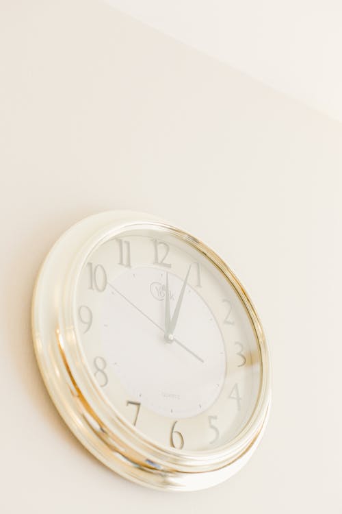 Free Wall Clock Hanging on a Wall Stock Photo