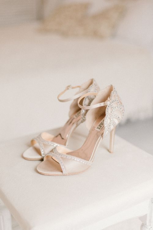 Free Elegant ivory high heel shoes with crystal embellishments, perfect for weddings or formal events. Stock Photo
