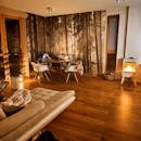 Woman in the Corner of a Warm and Cozy Living Area