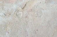 Textured background of rough wall with bumpy surface