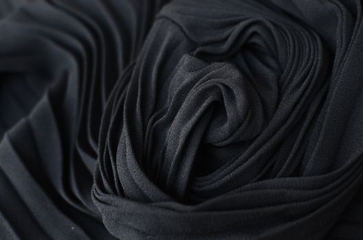 Abstract background of black fabric on table