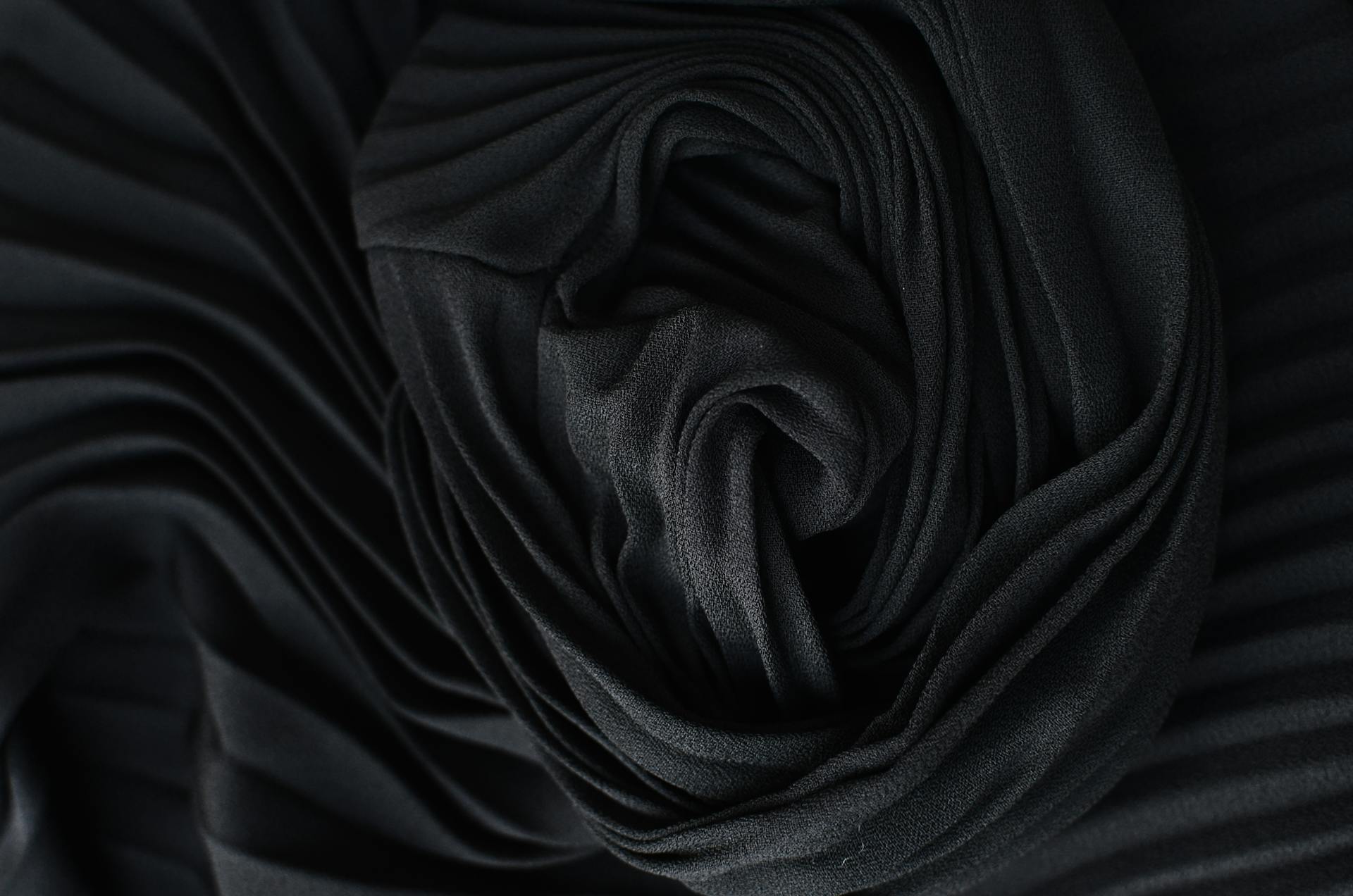 Black pleated fabric placed on table