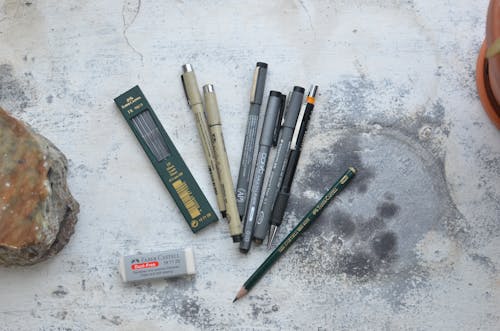 Pencils and pens for art in workshop