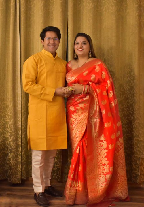 Free Smiling Indian couple in traditional clothing, capturing a festive moment indoors. Stock Photo