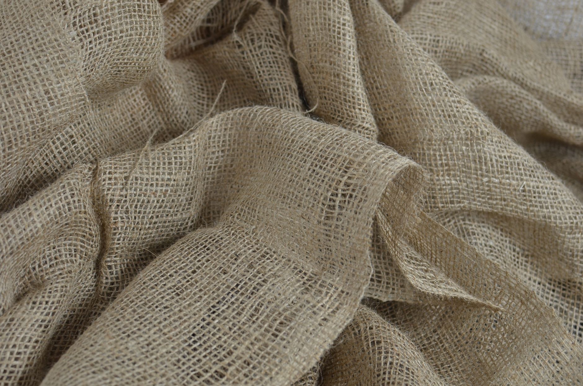 Textured background of organic sackcloth with tiny holes