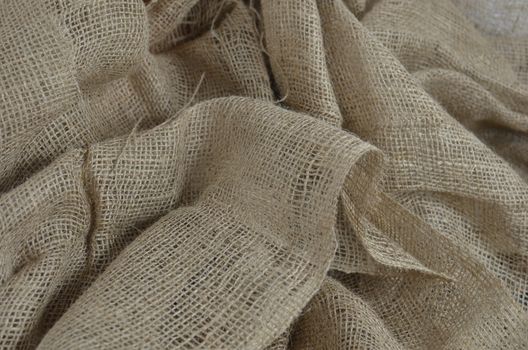 Textured background of organic sackcloth with tiny holes