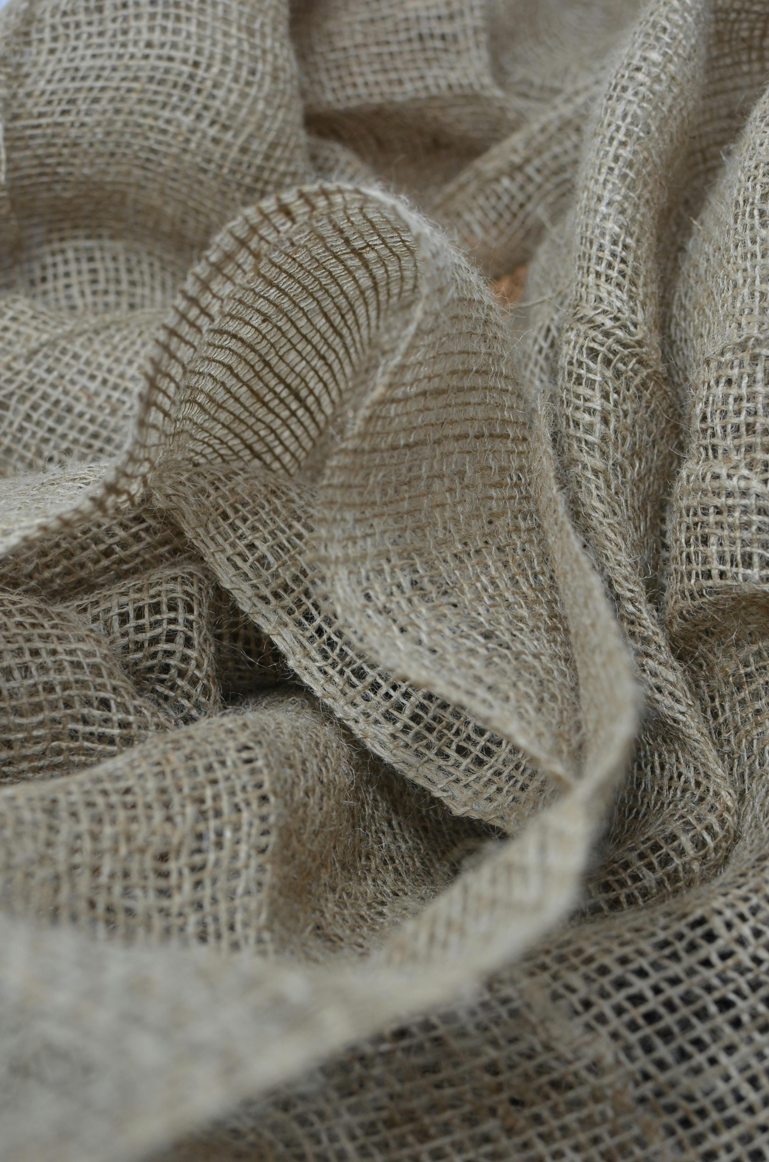 textured backdrop of eco sackcloth with crumpled surface