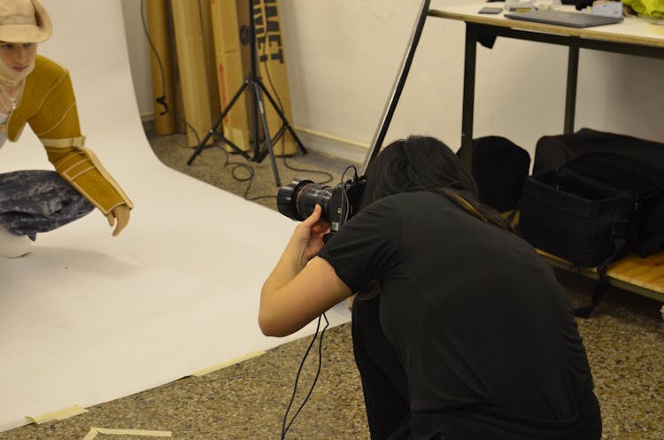 Professional Photographer Shooting Model In Studio