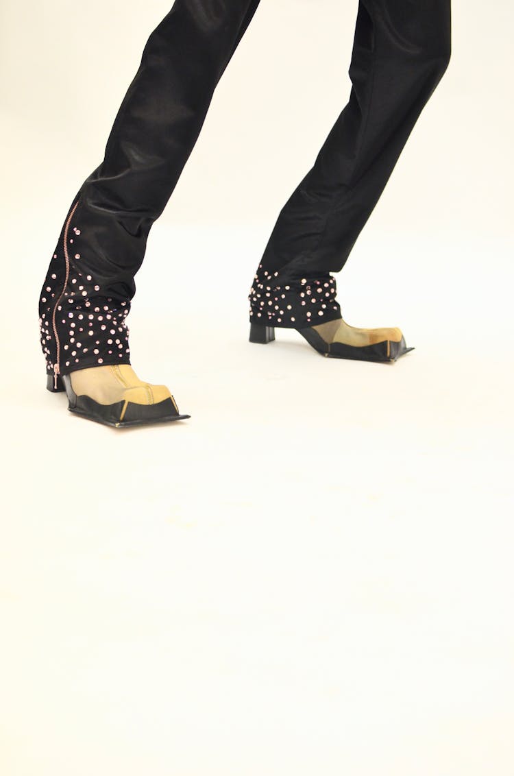 Stylish Person Wearing Eccentric Boots And Pants With Rhinestones