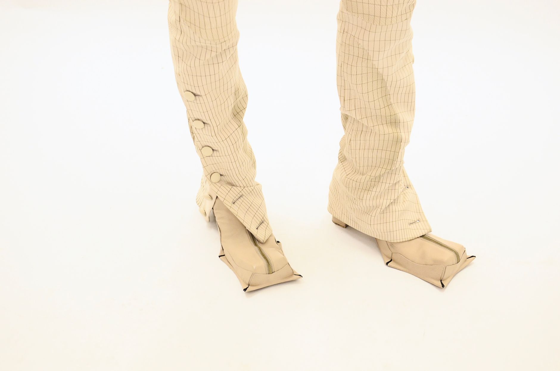 comparison of two ponte trousers at the knee showing one with excellent shape retention and one with visible bagging after wear