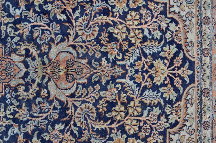 Abstract Background Of Carpet With Floral Ornament