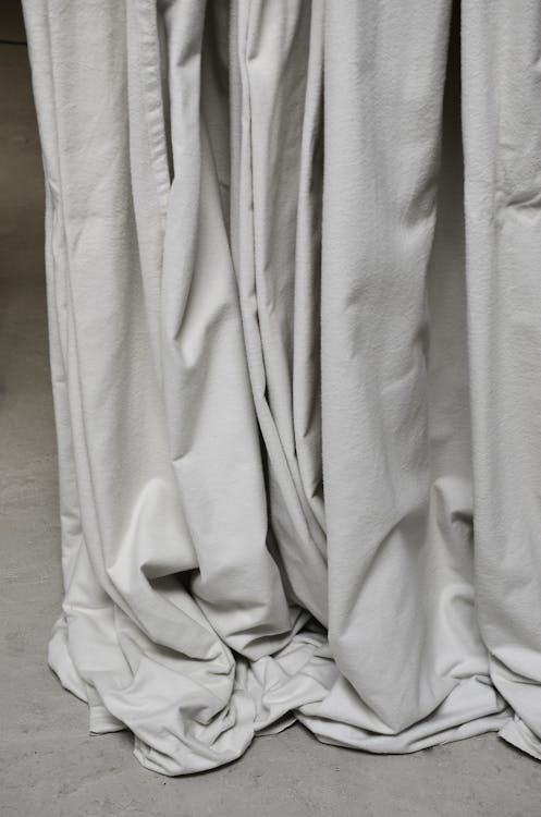 Gray draped cloth hanging in room