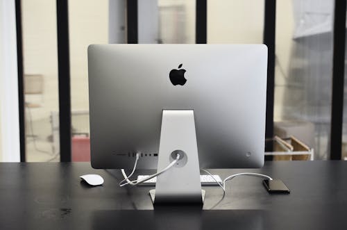 Modern convenient computer on table with smartphone in office